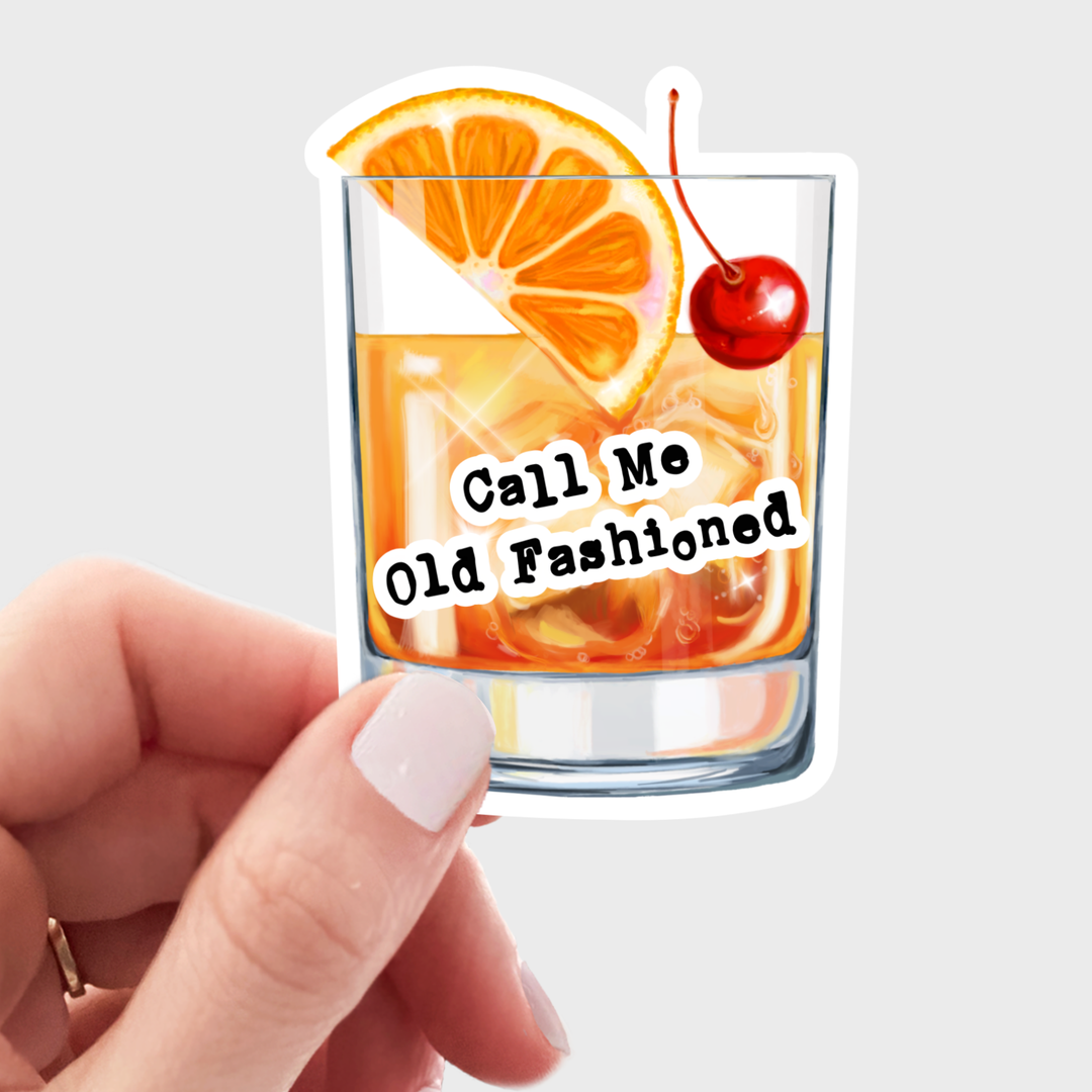 Old fashioned glass with an orange slice and cherry with hand lettered text in black.