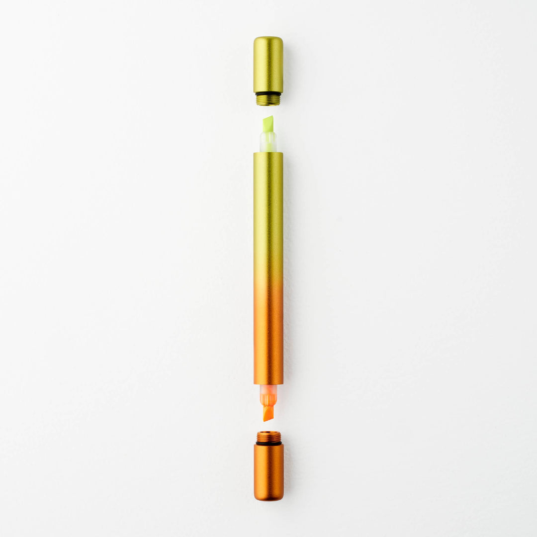 Gradient yellow to orange pen with caps off at either end showing a yellow tip at top and an orange tip at the bottom.
