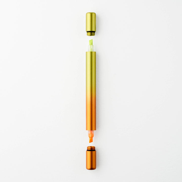 Gradient yellow to orange pen with caps off at either end showing a yellow tip at top and an orange tip at the bottom.