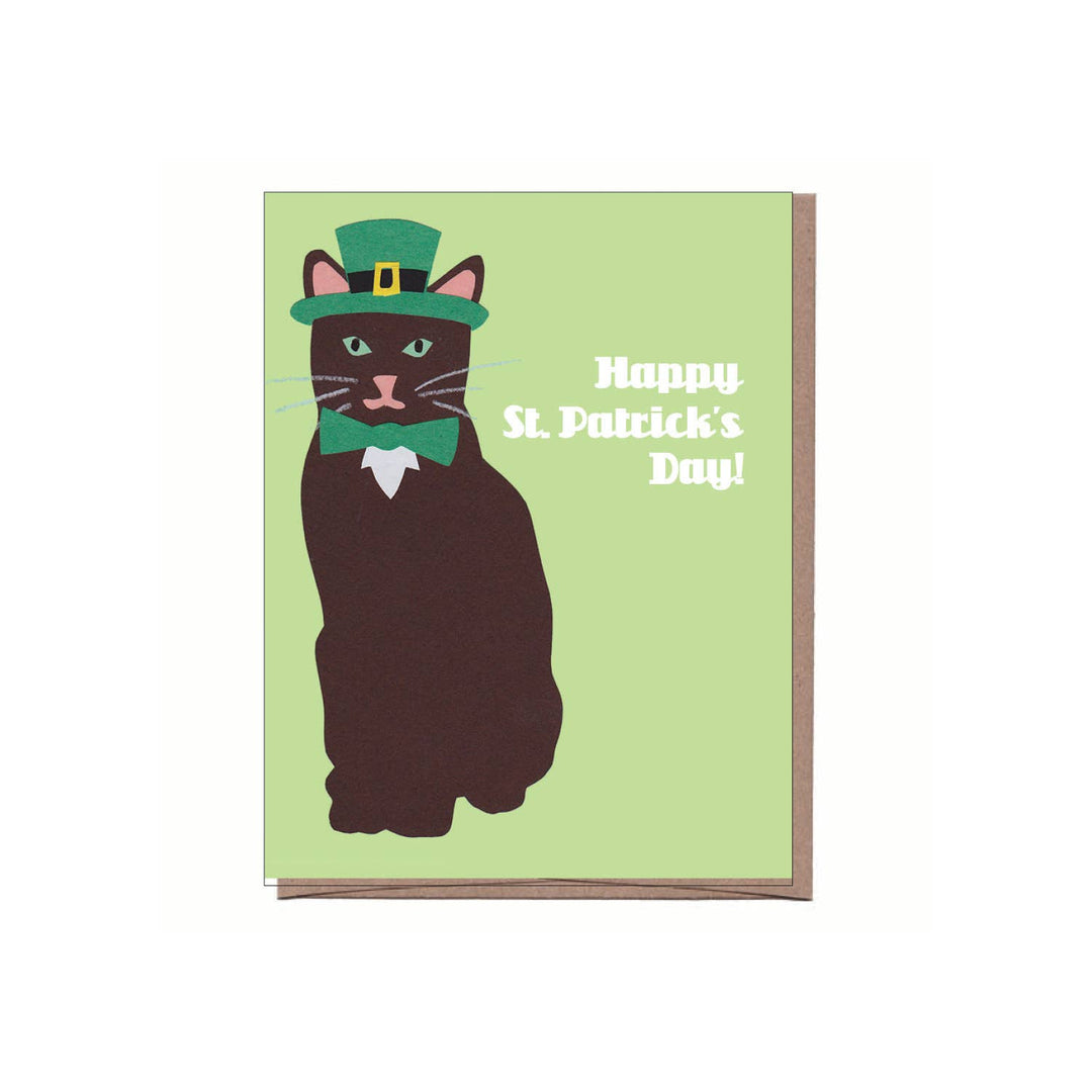 Front of card with an illustration of a cat wearing a leprechaun hat and bow tie on a green background.