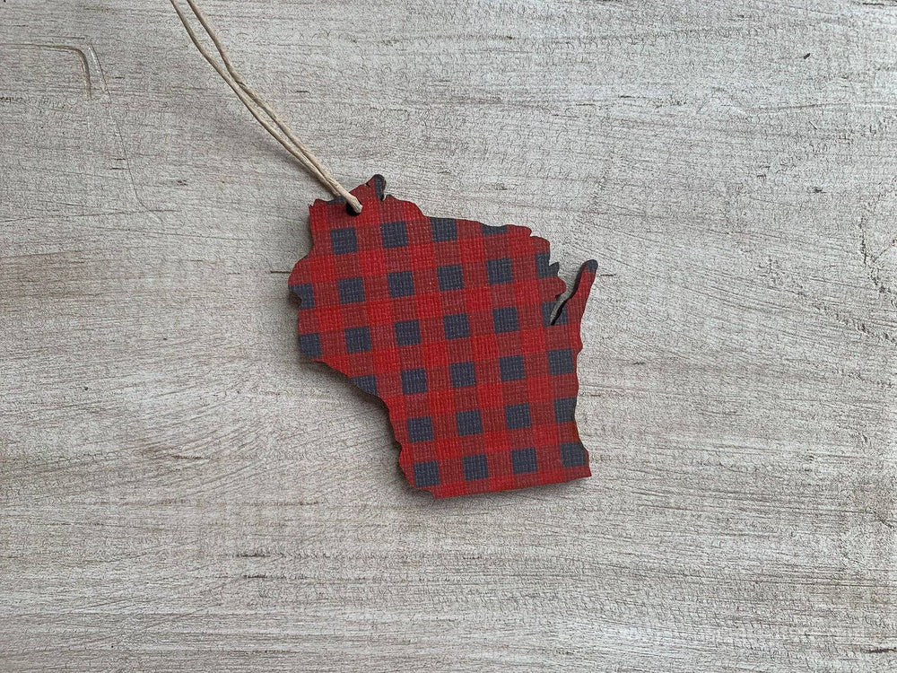 Ornament cut in the shape of the state of Wisconsin in red buffalo plaid and a hanging string.
