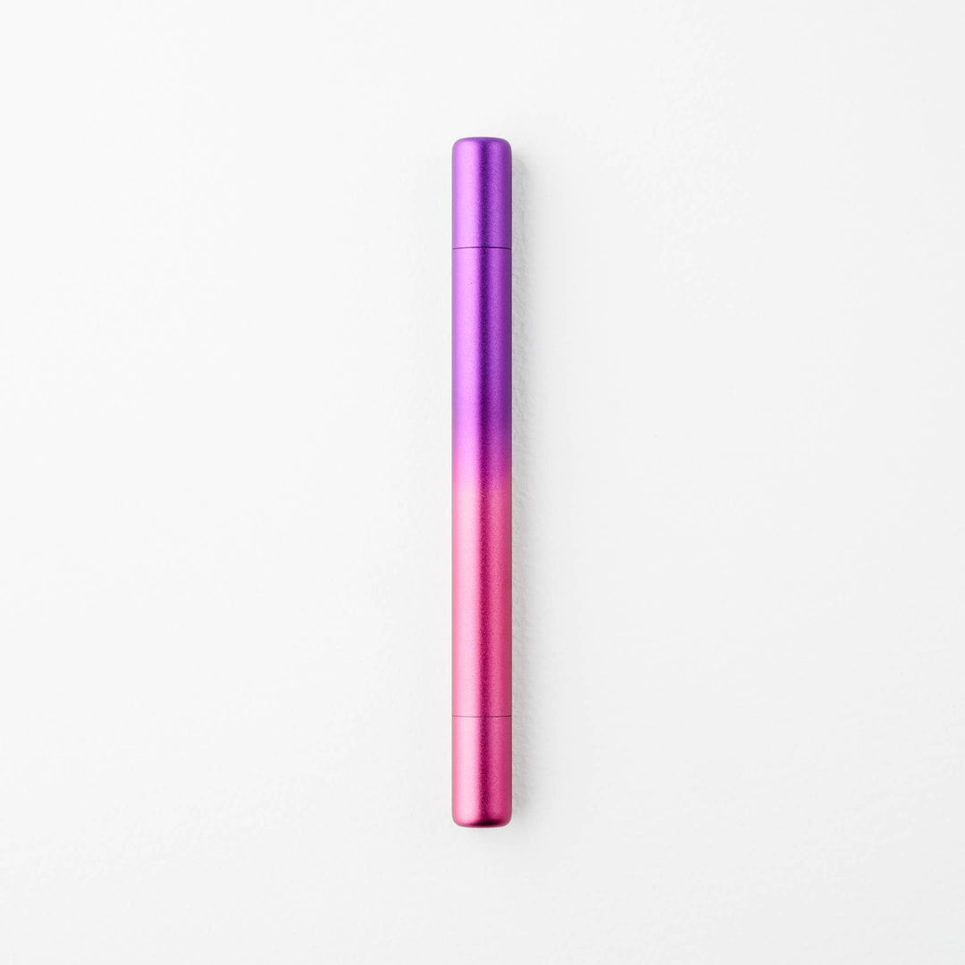 Gradient purple to pink pen with caps on either end.
