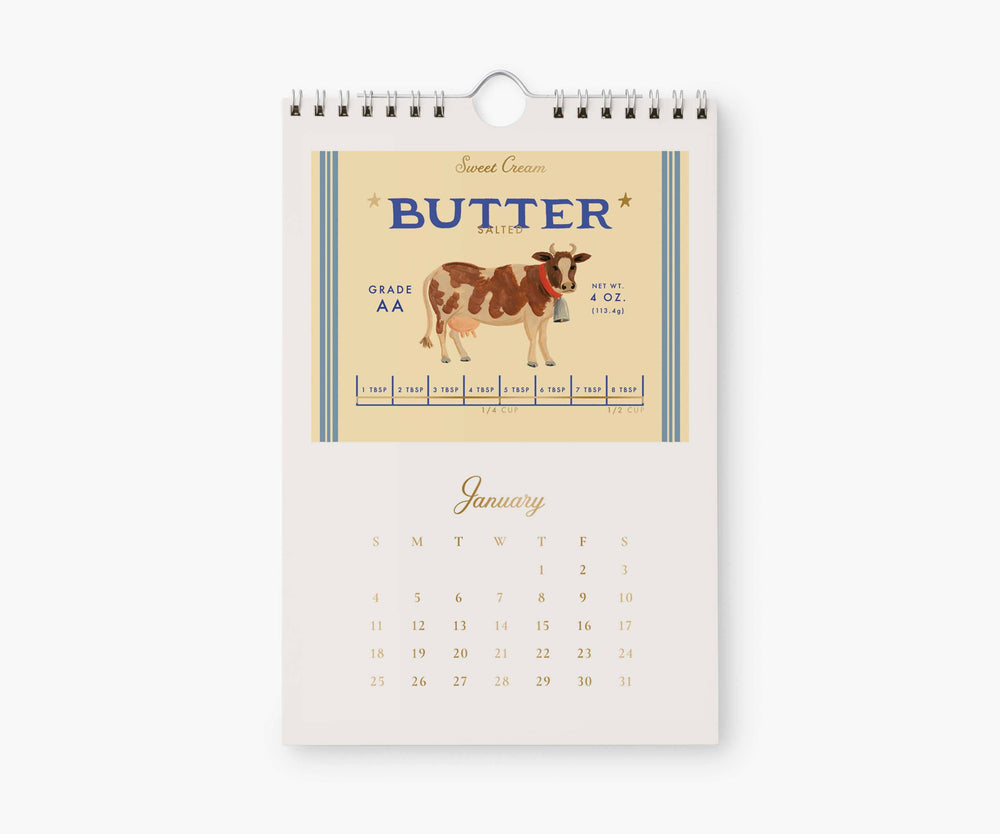 Calendar page for January with illustration of a wrapper for 4 ounces of grade AA butter, with a brown and beige cow in the center, above the calendar for January, 2026.