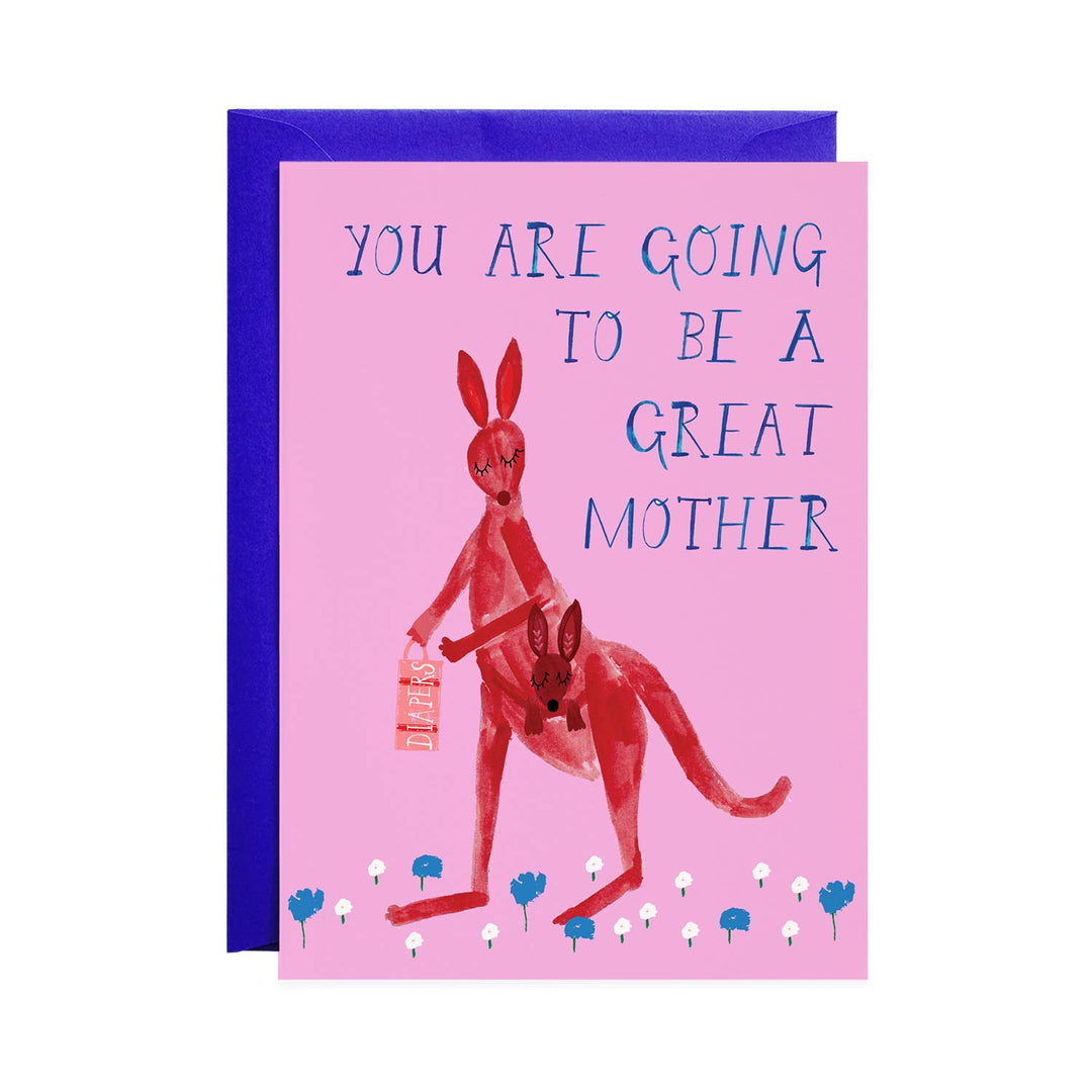 A whimsical red kangaroo, with joey in pouch, in a field of white and blue flowers on a pink card with blue envelope. The text, in all capital letters, is in a blue serif font.