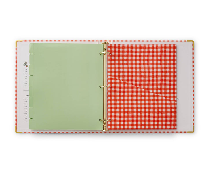 Green tabbed divider on left and red and white pocket folder on right.