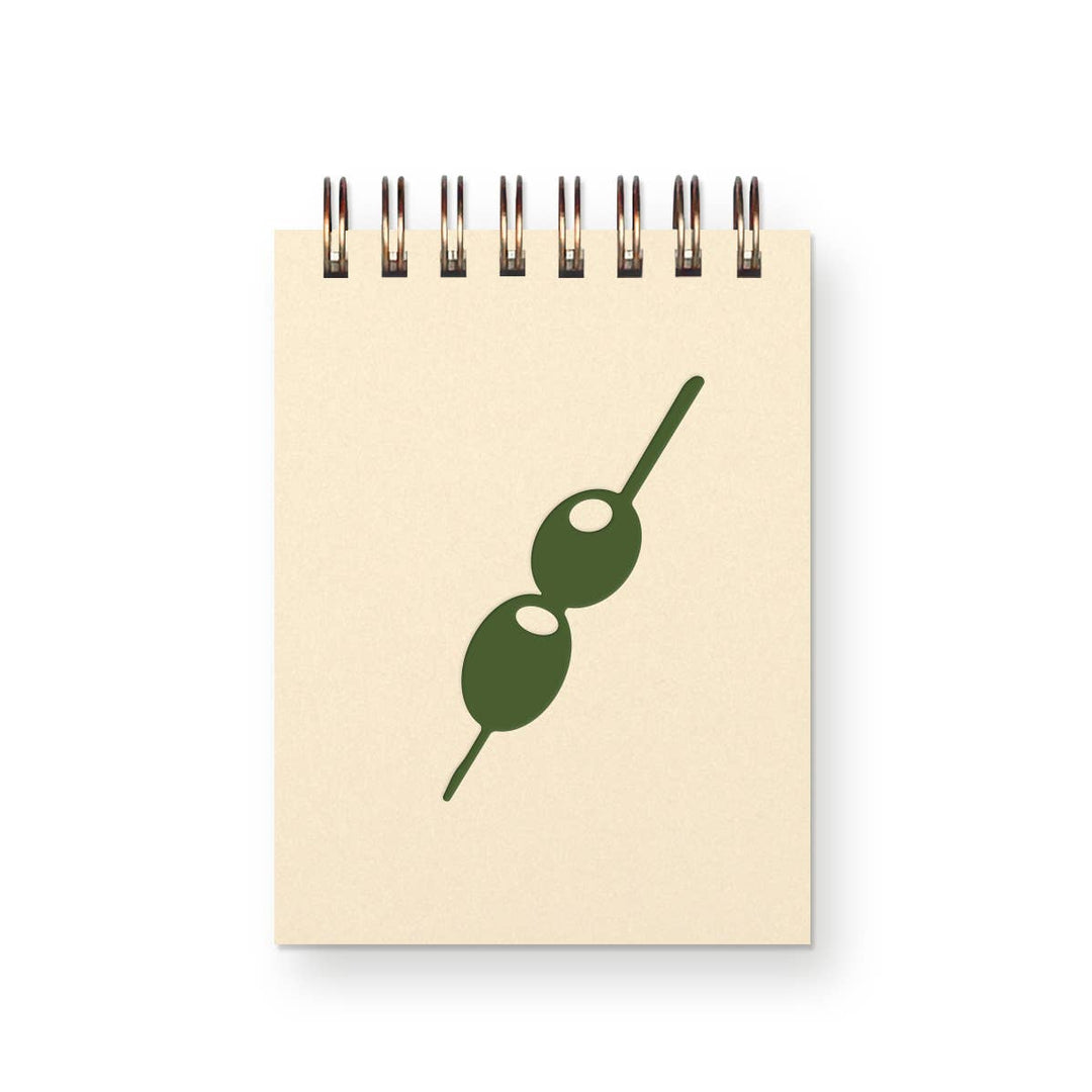 Small spiral-bound notebook with drawing of two olives on a toothpick on cover