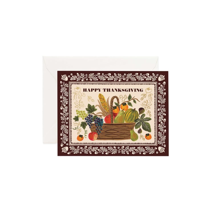 Thanksgiving card with a basket of fruits and vegetables and decorative border.