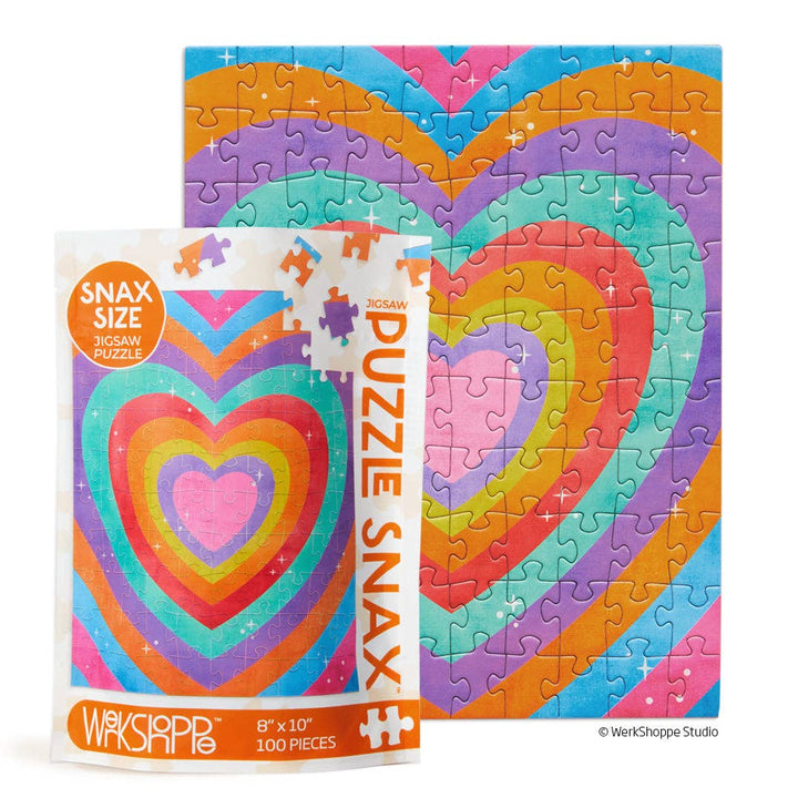 Snax pouch in front of completed puzzle of concentric hearts in bright colors.