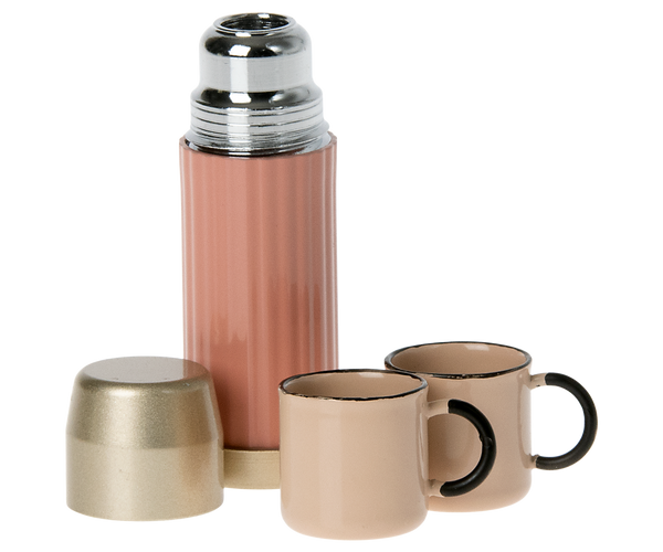 Hiking mouse's metal camping thermos and two mugs.