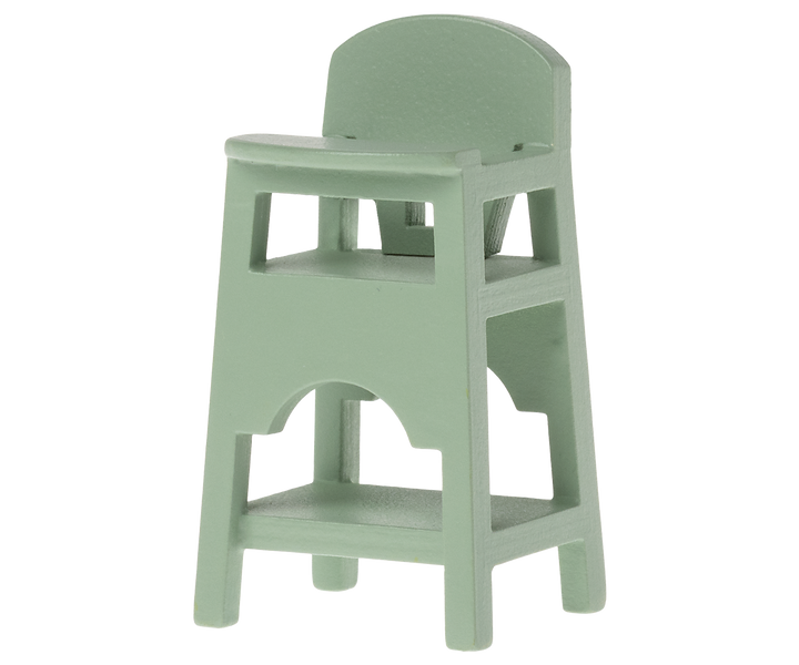 Green high chair with tray and lower shelf.