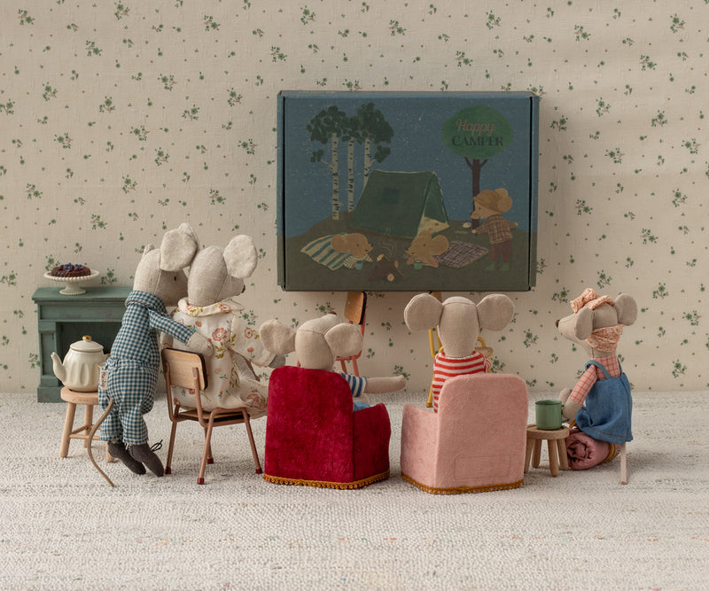 Scene of mouse family watching a video.