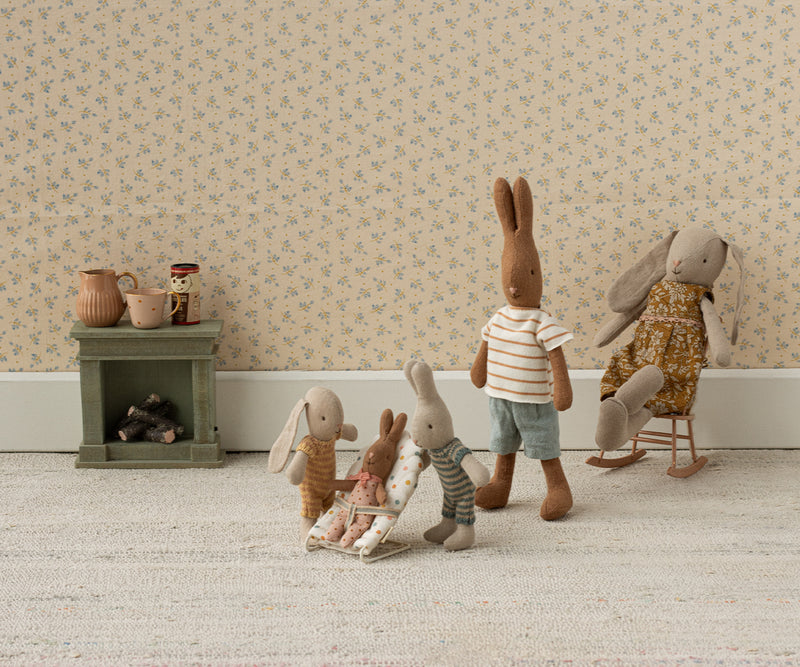 Diorama of Mouse family watching baby mouse in the bouncer.