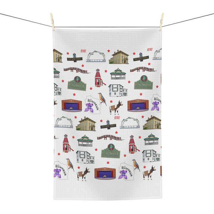 White tea towel with Janesville landmarks hanging on a clothesline.