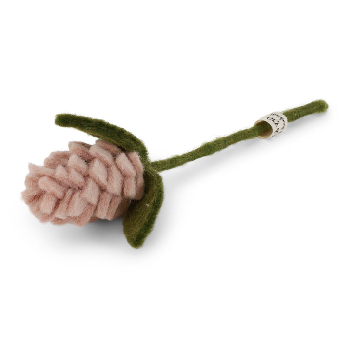 A handcrafted felt flower stem with a dusty pink bud and olive green stem and leaves