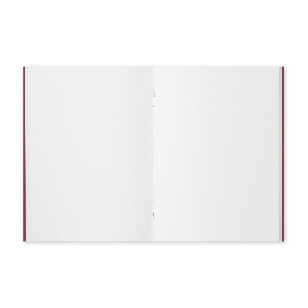 Open notebook showing blank pages.