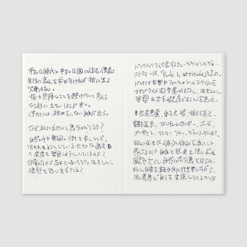 Open notebook showing Japanese characters on the lightweight paper.