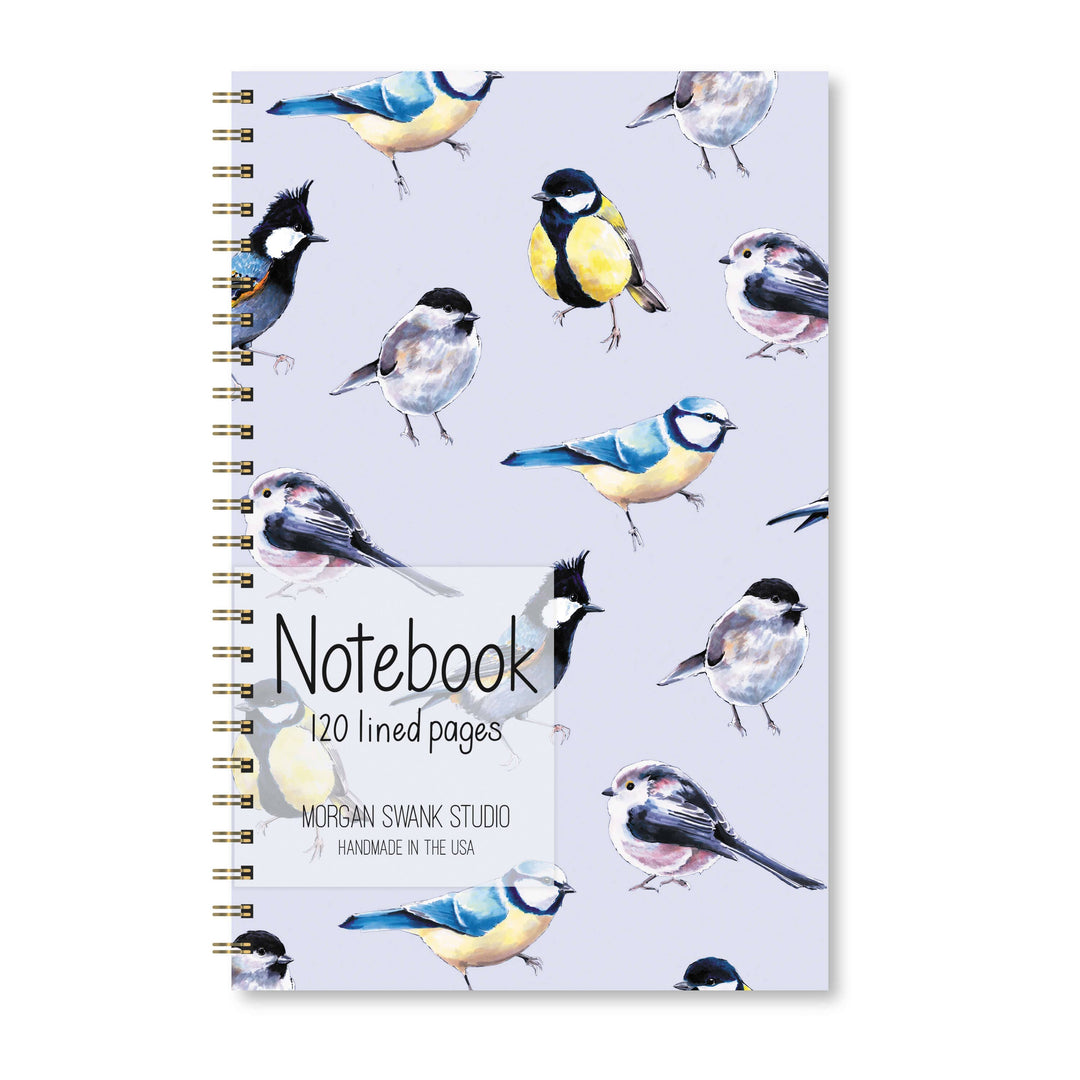 Notebook with bird illustrations on a light blue background