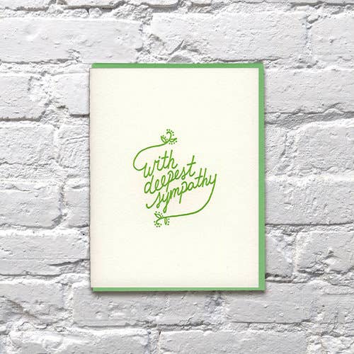 Green cursive text on white cardstock