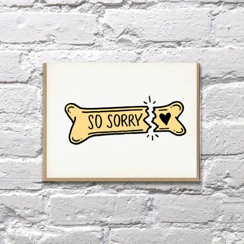 Stylized drawing of a broken yellow bone with black text on on white cardstock