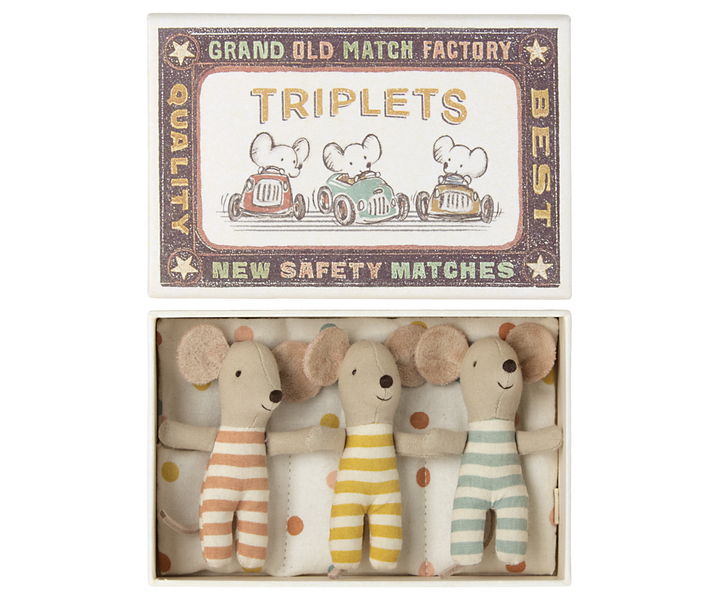 Three little mice wearing complementary pastel stripes, one aqua, one lemon, one rose, in a safety match box.