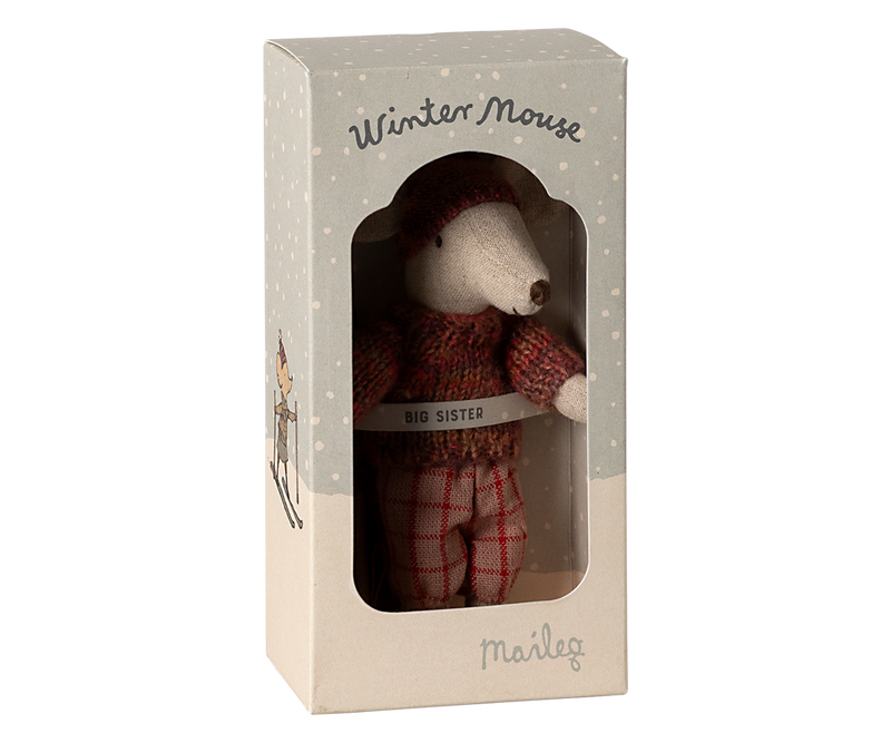 Mouse dressed in orange-pink winter clothing in box labeled "Winter Mouse Big Sister."