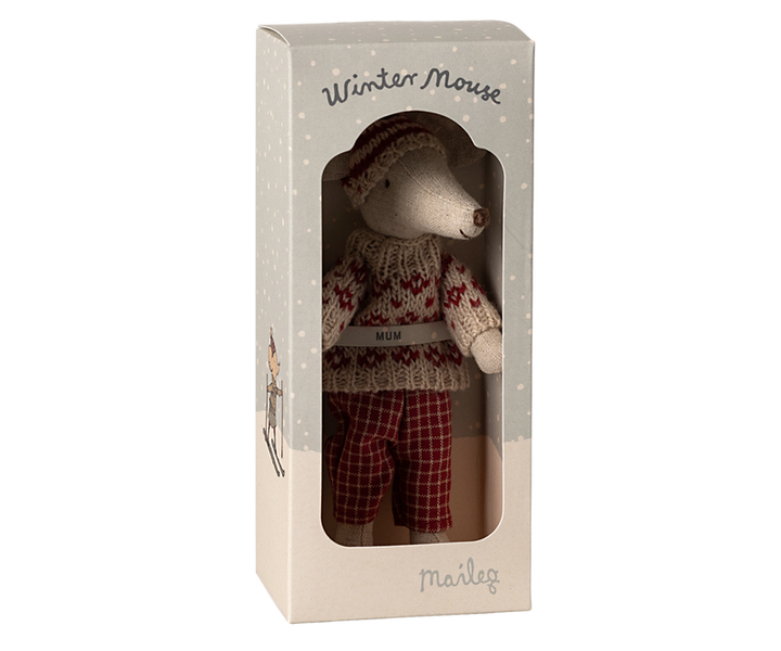 Mouse dressed in red and beige winter clothing in box labeled "Winter Mouse Mum."
