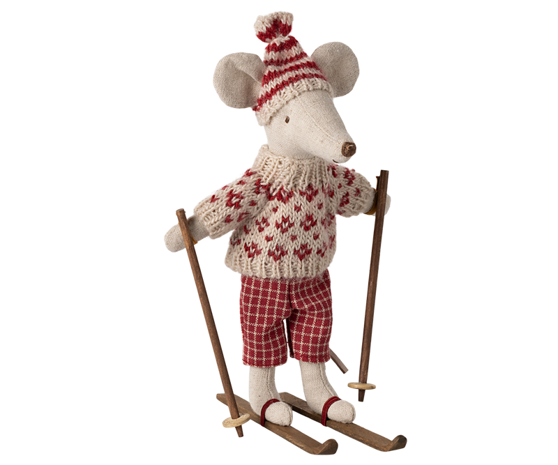 Mouse dressed in red and beige winter clothing on skis and holding poles.