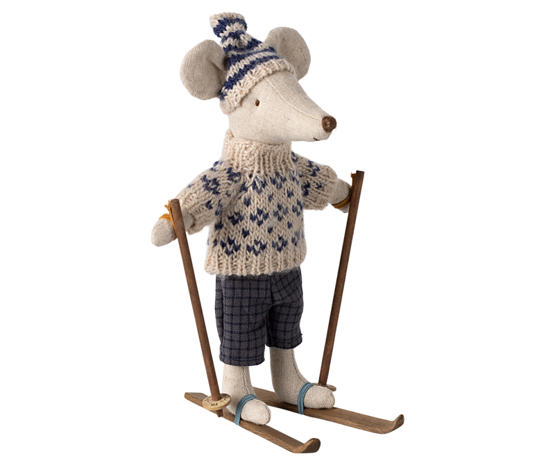 Mouse dressed in dark gray and beige winter clothing on skis and holding poles.