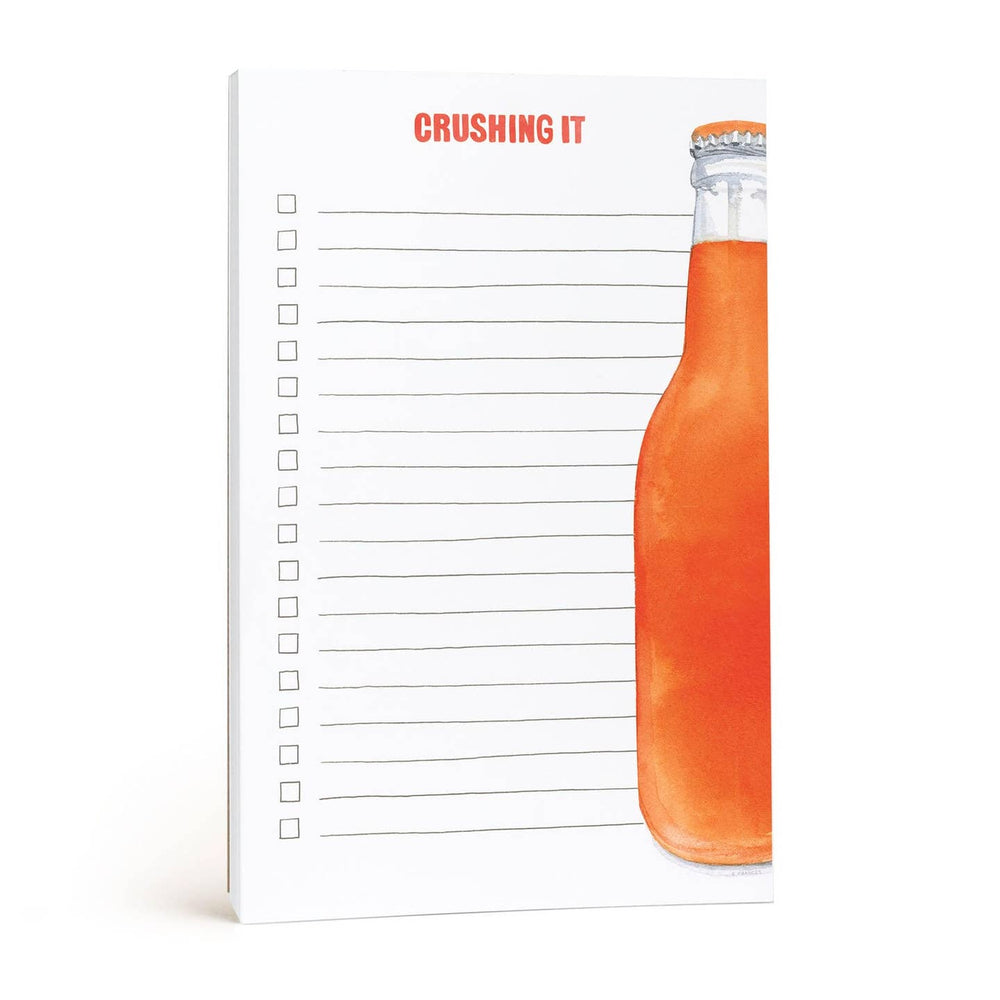 Lined checklist notepad with a colorful orange soda bottle design and 'Crushing It' text 