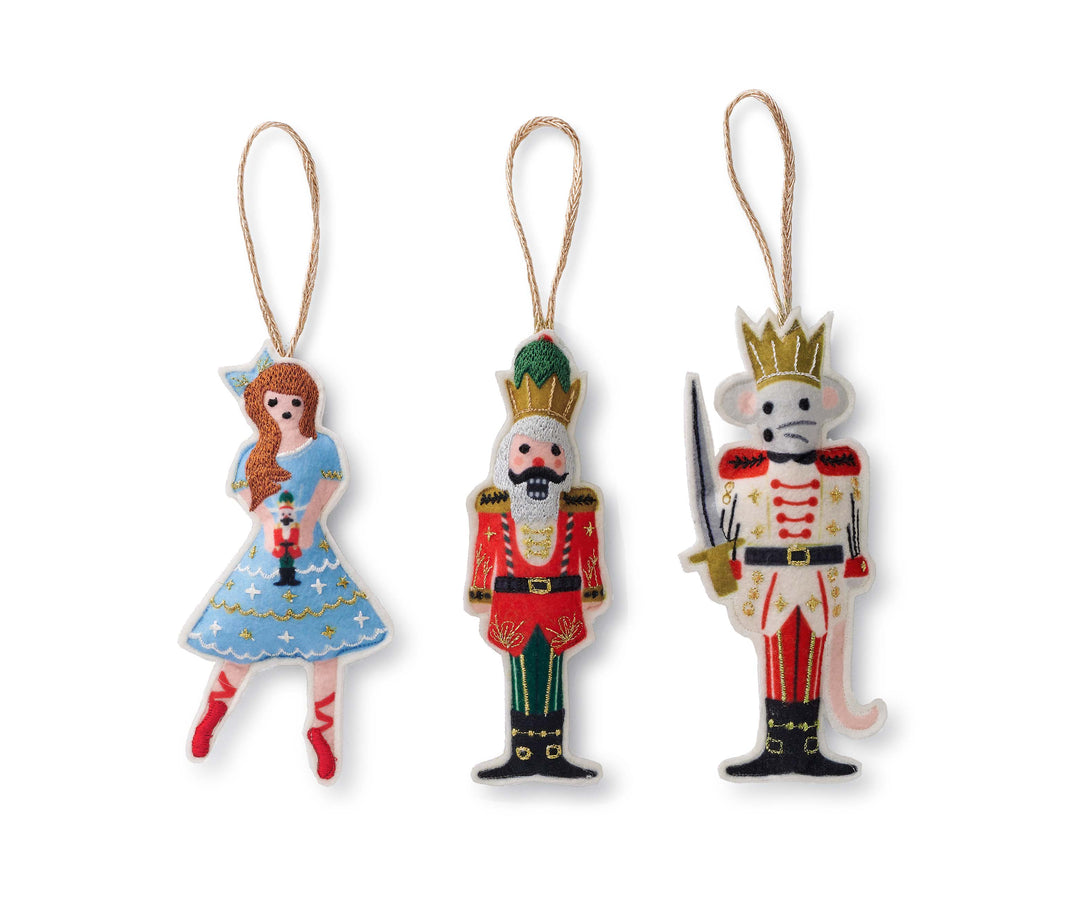 Three ornaments side-by-side, Clara,  Nutcracker Prince, and the Mouse King.