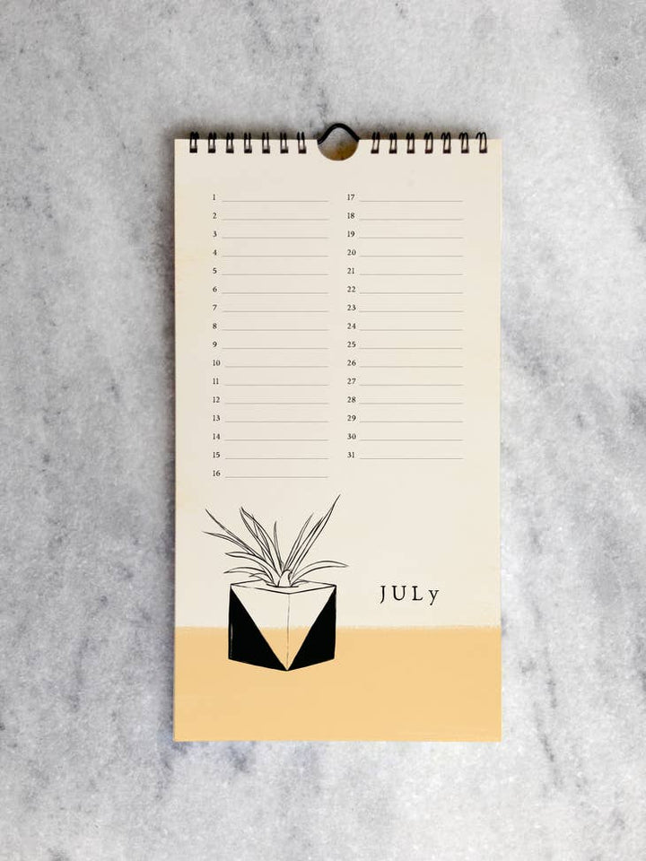 The page for July with a drawing of a potted plant on a light yellow background below a line for each day in the month.