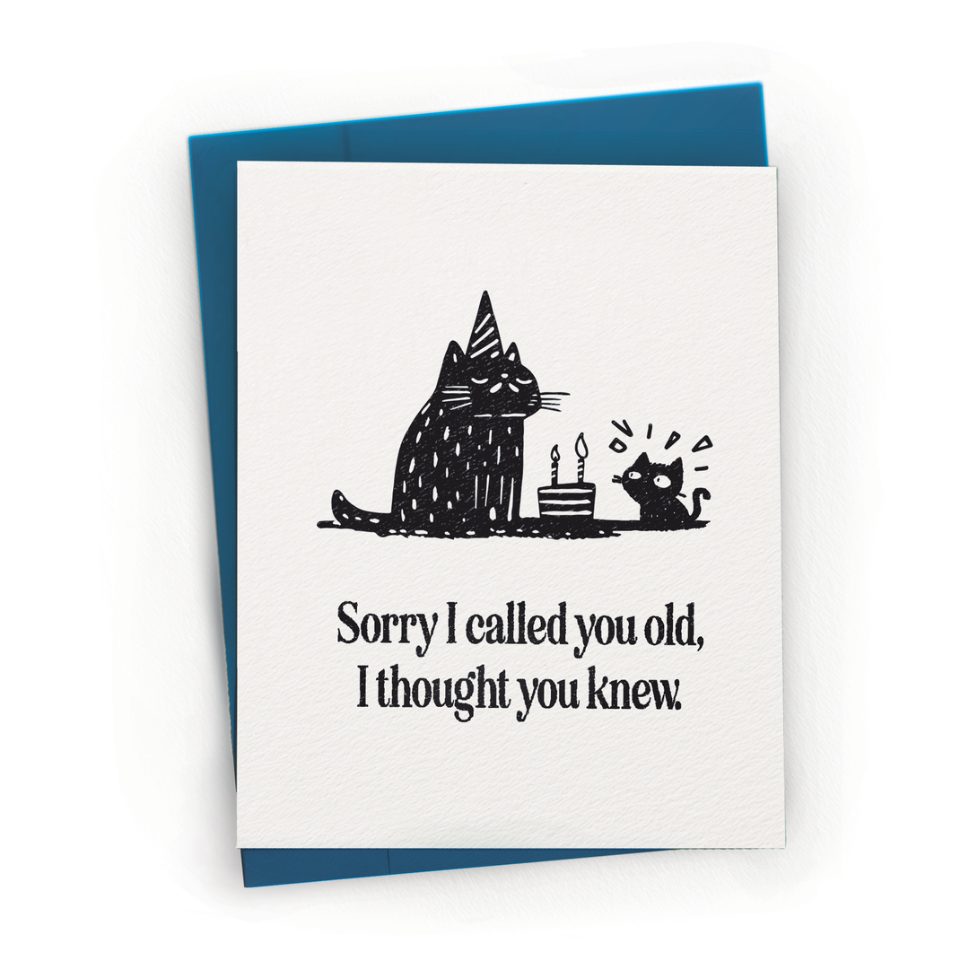 Greeting card with black cat illustration and humorous text on a white background