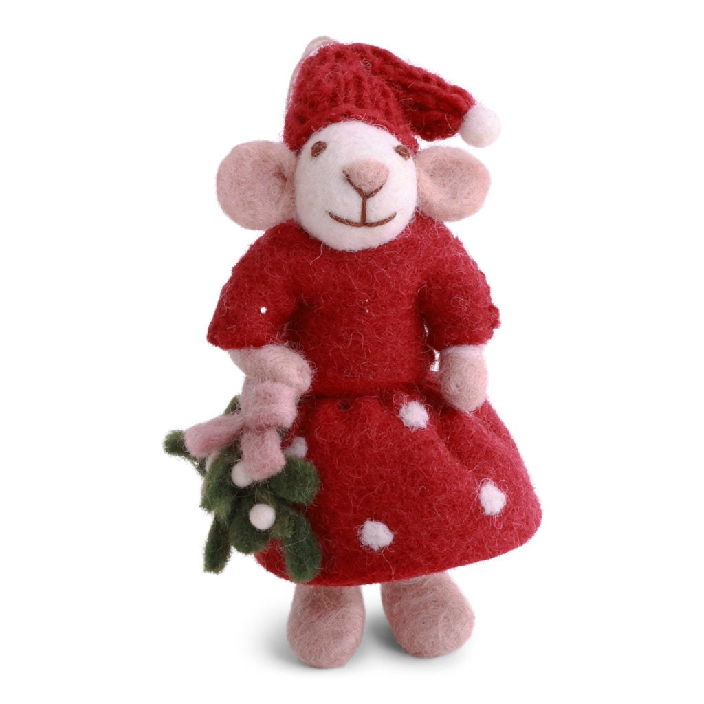 A handcrafted felted wool mouse wearing a red dress with white polka dots and a matching red Santa hat, holding mistletoe.