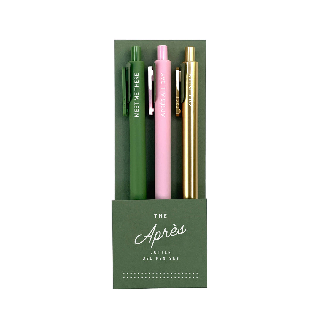 Green, pink, and gold pens with descriptive text in a green packaging sleeve labeled'The Après' Jotter Gel Pen Set.