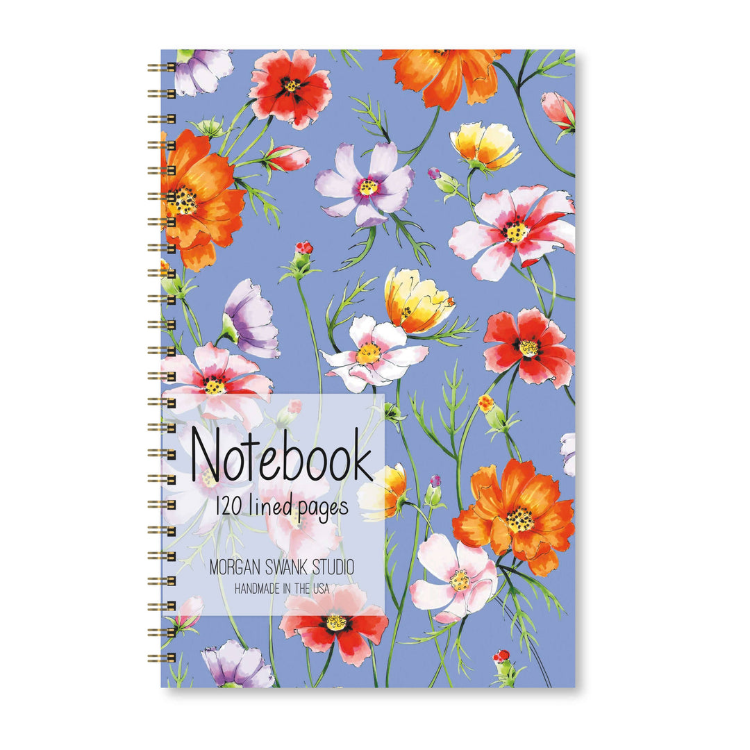 Notebook with floral design on a blue background