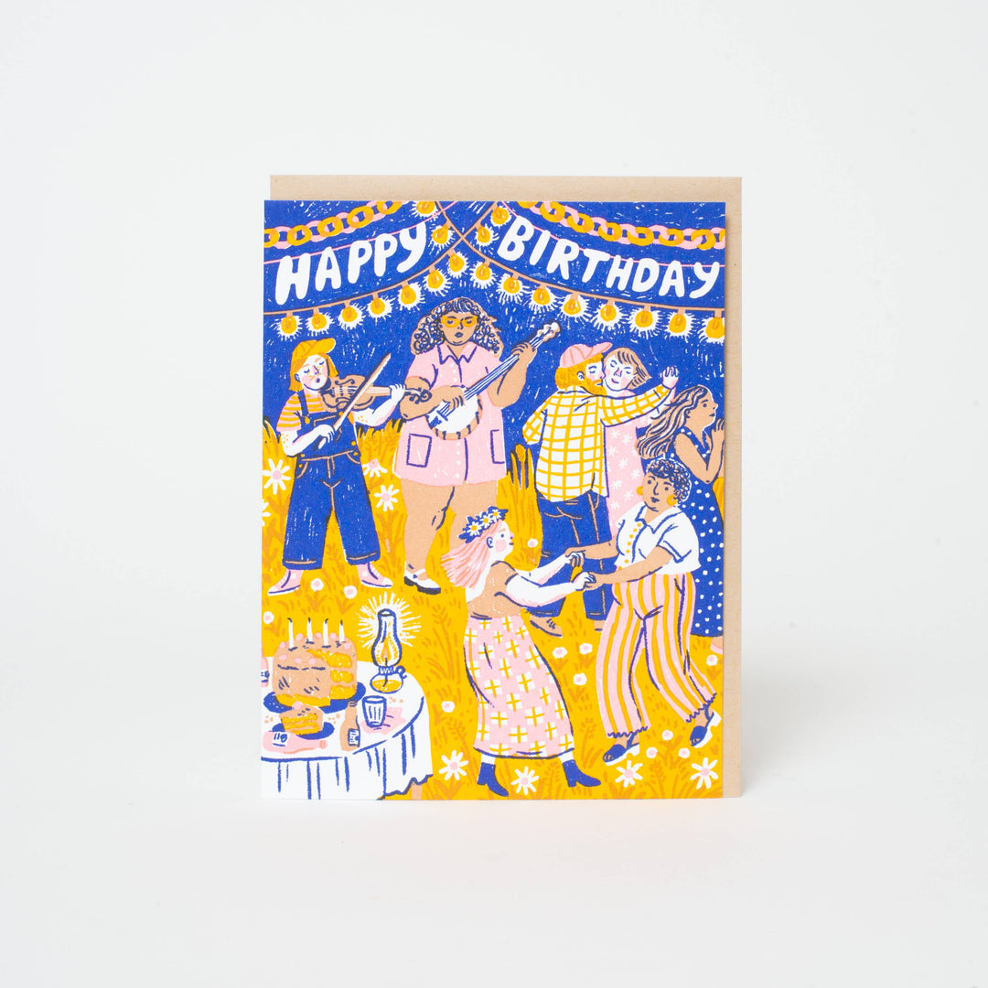 White "happy birthday" text on blue background with drawing of dancing in a barn.