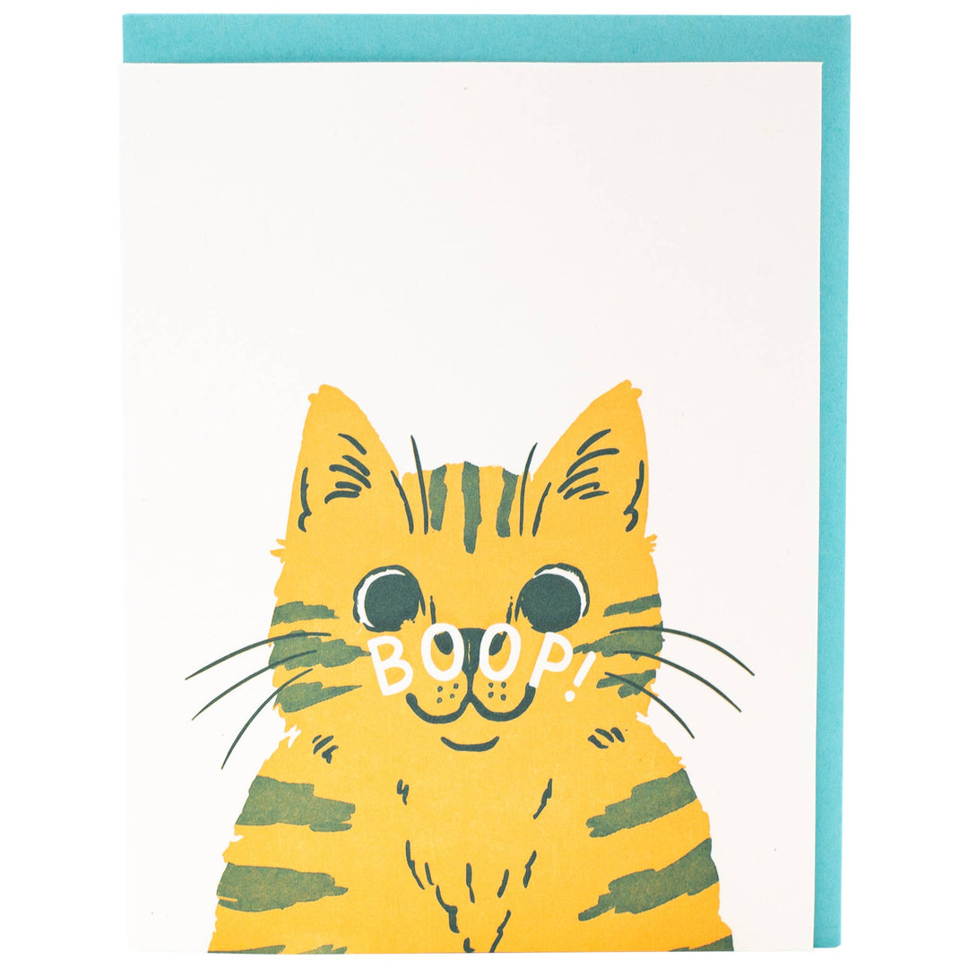 Drawing of a yellow cat with 'BOOP!' text across its nose. 