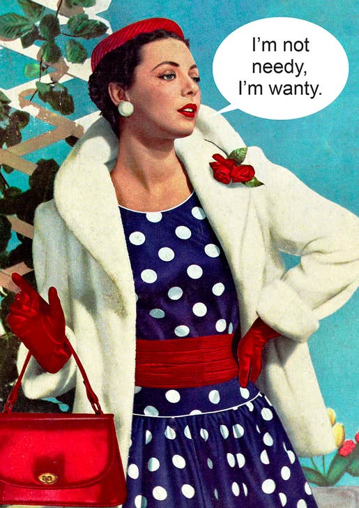 A 50's styled woman wearing a polka dot dress with red cummerbund, purse, and hat, and white coat, looking haughty.