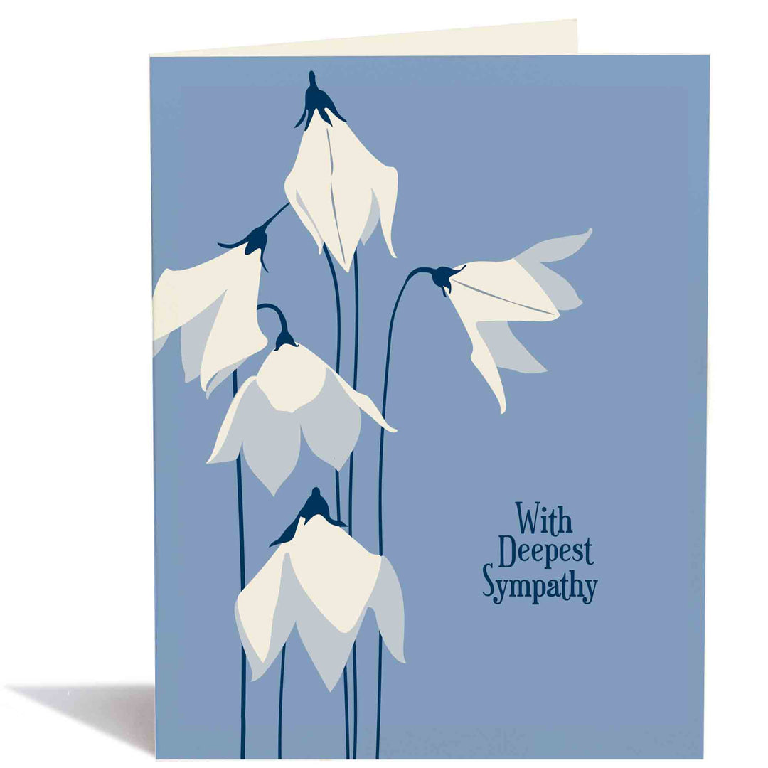 Drawing of white bell flowers on blue cardstock with dark blue text.