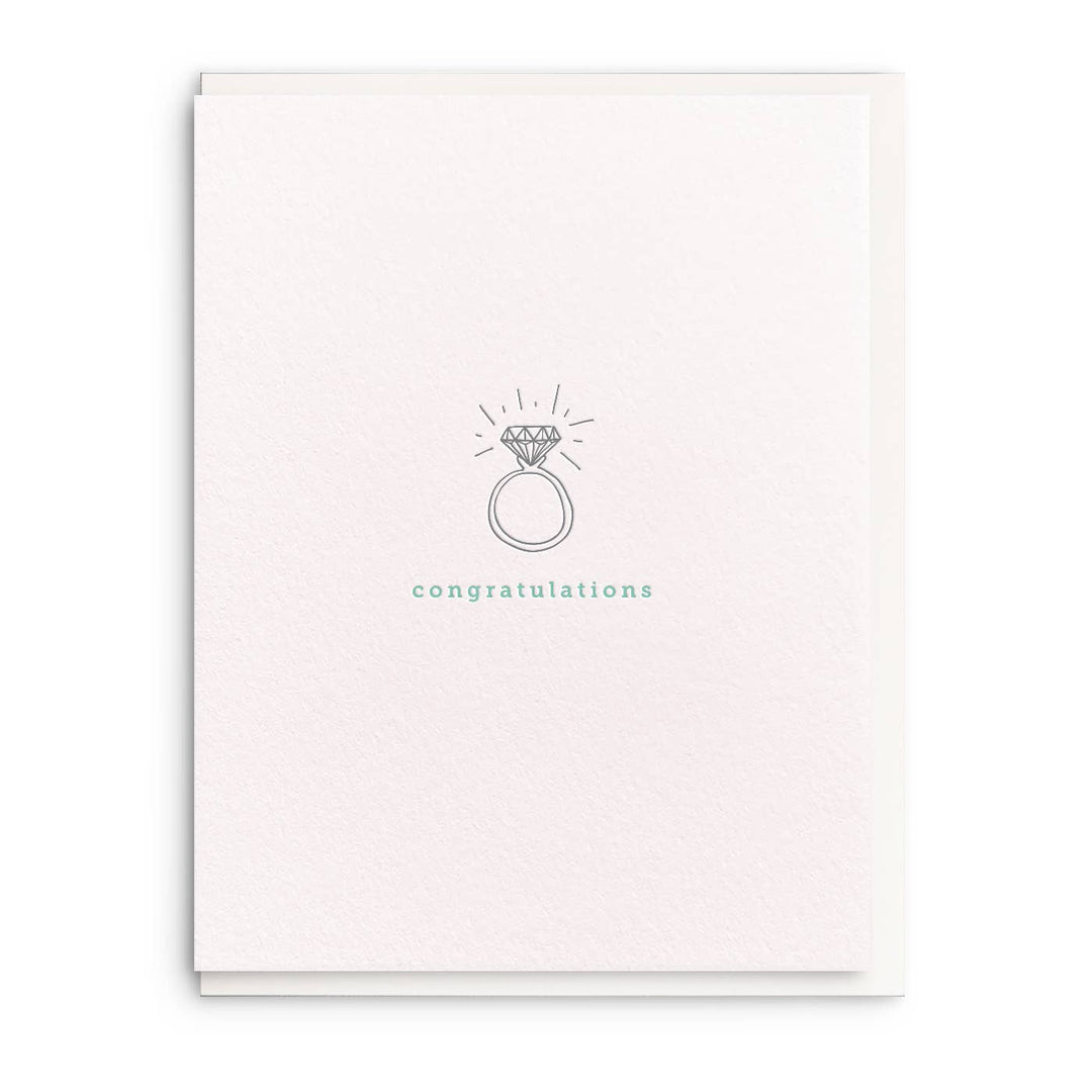 Line drawing of a diamond engagement ring in black ink over aqua text on a white background