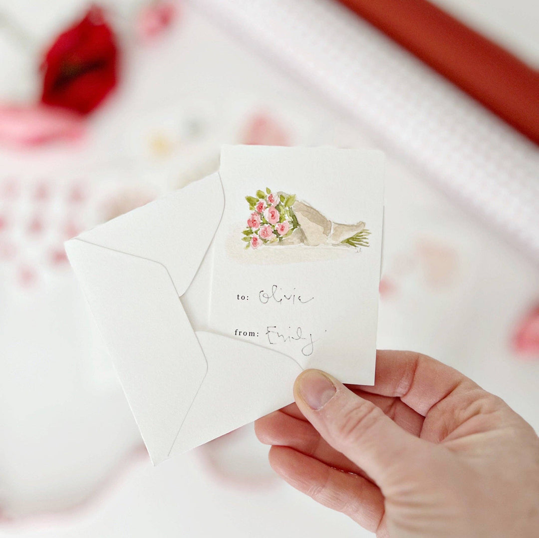 One of the mini-valentine cards, with a bouquet of cut flower above "to" and "from" spaces.