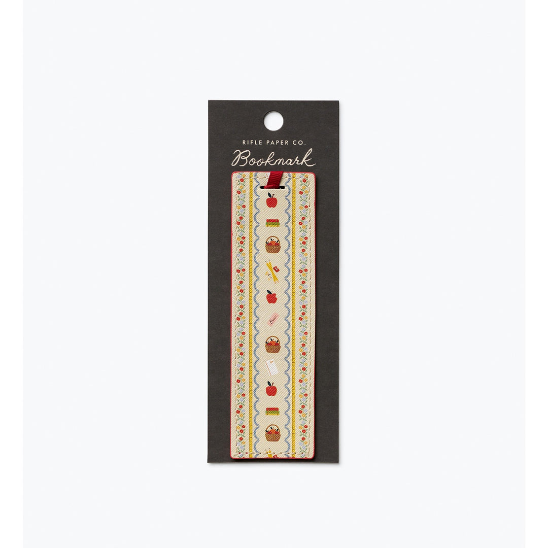 Bookmark with images of school-related objects, like apple and pencils.