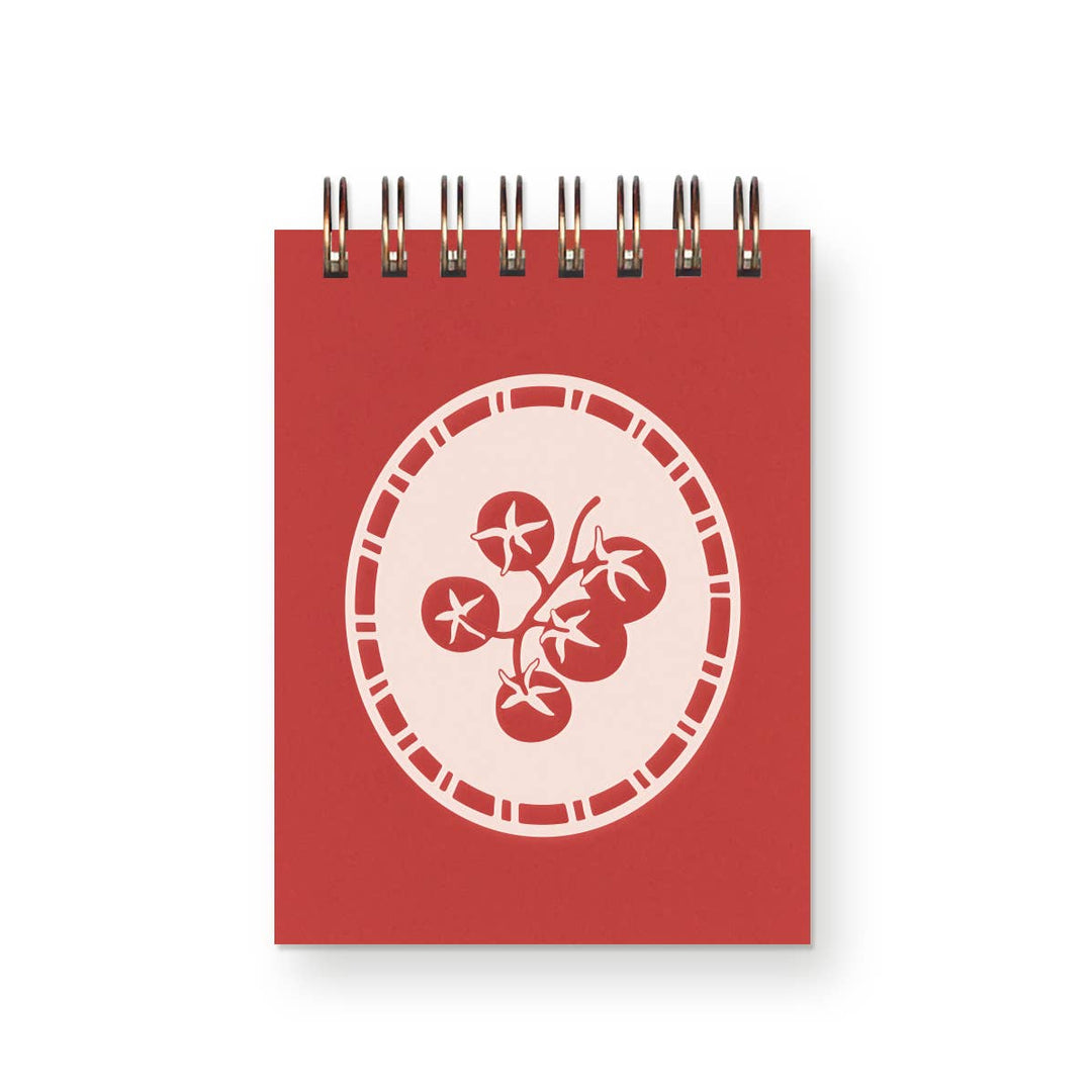 Red spiral-bound mini notebook with drawing of tomatoes on front