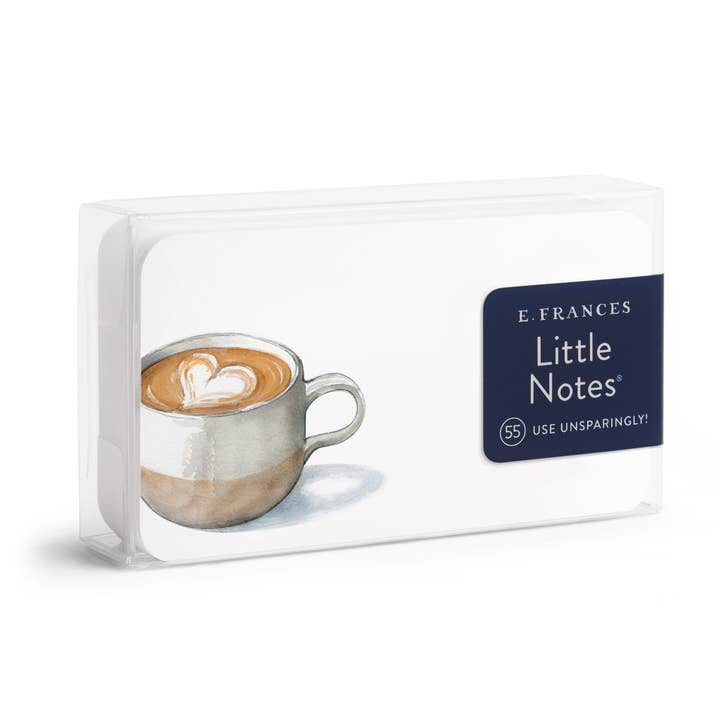 Pack of little notes with cup of coffee with foam heart on a white card.