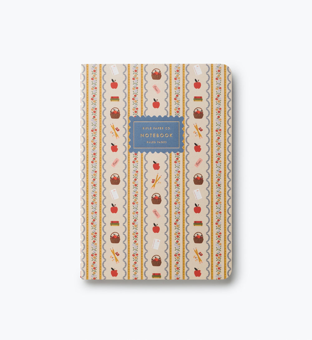 Cover of notebook with paisley accents and images of school-related objects.