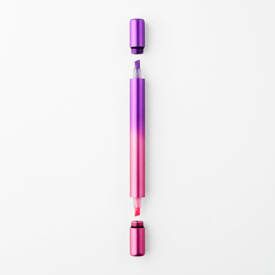Gradient purple to pink pen with caps off at either end showing a purple tip at top and a pink tip at the bottom.