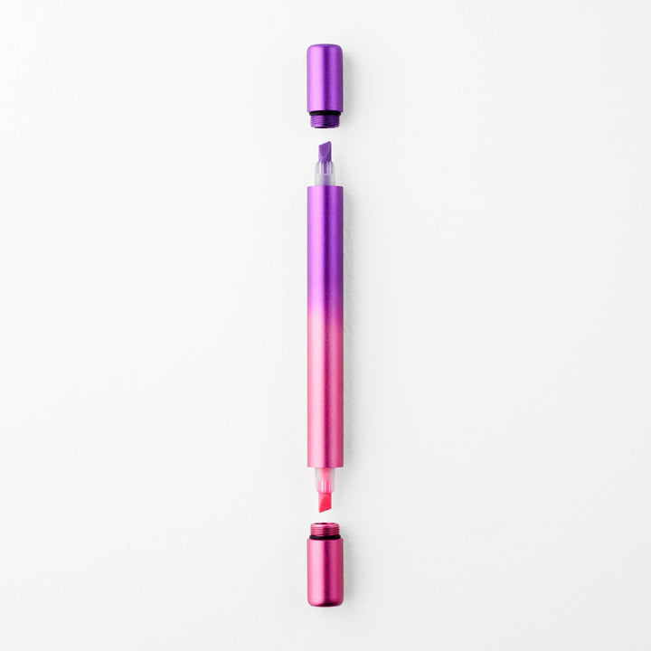 Gradient purple to pink pen with caps off at either end showing a purple tip at top and a pink tip at the bottom.