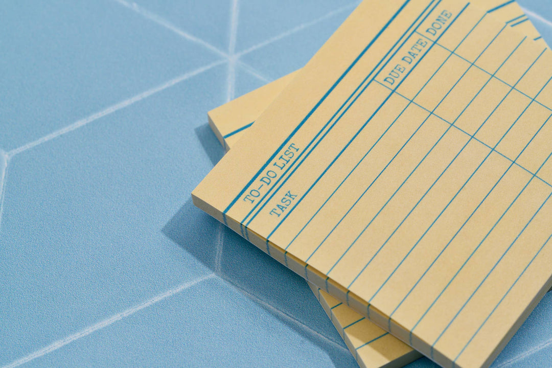 Yellow library card format with blue lines to separate task, due date, and done columns. 