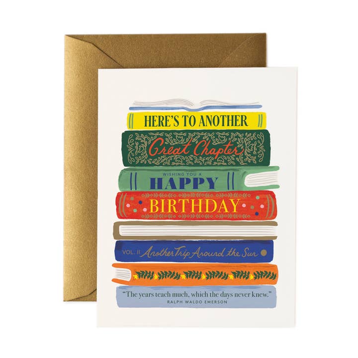 Front of card with a stack of books, the titles of which send a birthday message. The book on the bottom has a quote by Emerson.