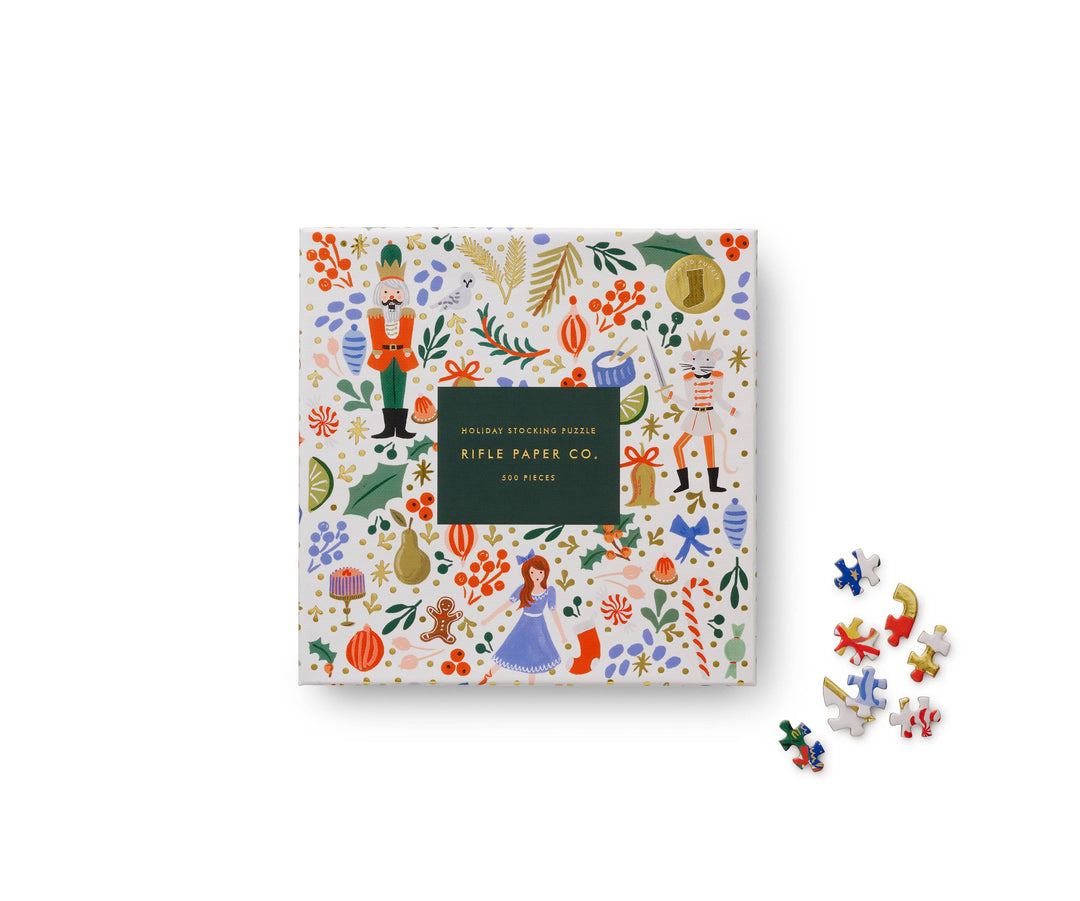 Box for nutcracker-themed puzzle with colorful figures from the Nutcracker ballet and a variety of other Christmas images.